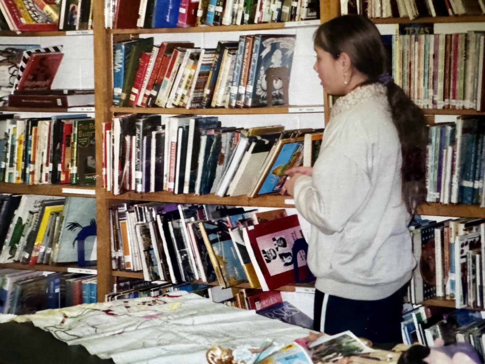 A young creator among books and artwork
